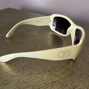 Cream color sunglasses.